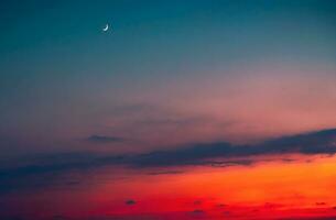 sorprendente tramonto con un' Luna foto