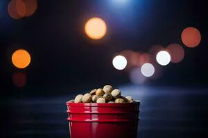 un' rosso secchio pieno con arachidi su un' buio sfondo. ai-generato foto