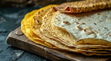 ai generato un' gamma di diverso tipi di messicano tortillas su un' tavolo su nero sfondo foto