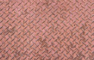 vecchio pavimento ondulato dipinto shabby color terracotta. foto