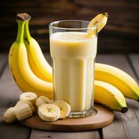 ai generato Banana succo su bicchiere foto