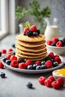 ai generato un' delizioso pila di Pancakes sormontato con fresco frutti di bosco e mirtilli foto