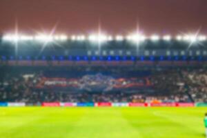 sfocato de-focalizzato stadio calcio crepuscolo sfondo. foto