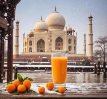 ai generato bicchiere di arancia succo e mandarini su neve nel davanti di taj mahal, agra, India foto