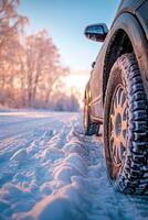 ai generato avvicinamento Immagine di un' auto pneumatici su il strada nel inverno. foto