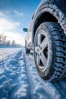 ai generato avvicinamento Immagine di un' auto pneumatici su il strada nel inverno. foto