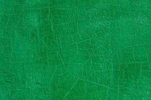 di spessore verde fresco olio dipingere su piatto acciaio superficie senza soluzione di continuità struttura con vecchio crepe sotto esso foto