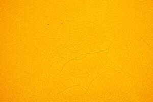 giallo Cracked acrilico pittura su parete sfondo. foto