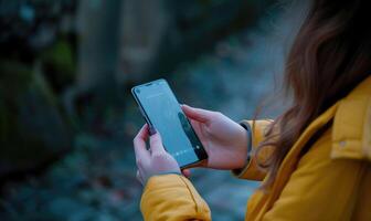 ai generato femmina mano Tenere smartphone con vuoto schermo su natura sfondo. finto su foto