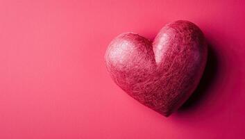 ai generato rosso cuore su un' rosa sfondo. San Valentino giorno sfondo con copia spazio. foto