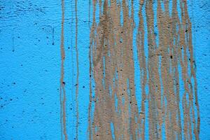 fango macchia su blu dipingere calcestruzzo parete struttura sfondo. foto