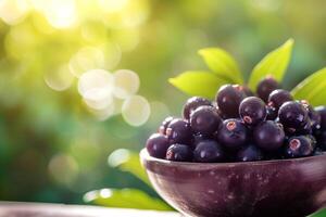 ai generato fresco acai frutti di bosco ciotola su naturale verde sfondo foto