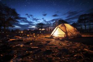 ai generato un' tenda è illuminato su a notte nel il mezzo di un' campo foto