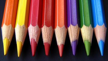 ai generato gruppo di colorato matite foderato su nel un' riga foto