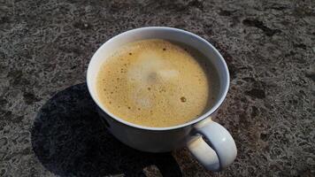 caffè tazza su strutturato sfondo. foto