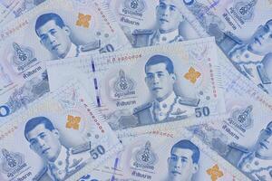 mucchio di nuovo 50 tailandese baht banconote. attività commerciale e finanza concetto. foto