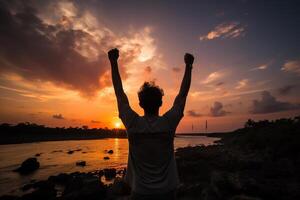 ai generato silhouette di un' contento uomo con il suo mani sollevato su contro il fondale di un' tramonto o alba. generato di artificiale intelligenza foto