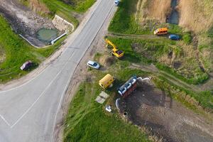 tecnica per pulizia canali e drenaggio sistemi a il incrocio stradale foto