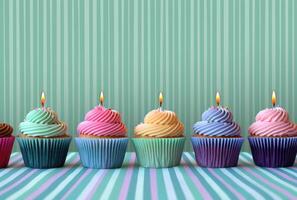 ai generato colorato cupcakes con scintillante candele su un' piatto nel blu foto