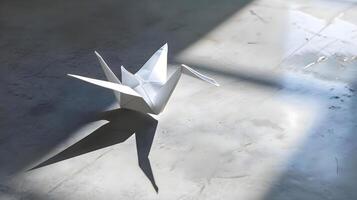 ai generato un' bianca origami uccello seduta su superiore di un' cemento pavimento foto