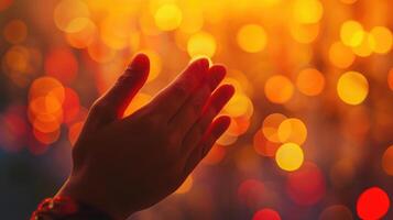 ai generato mano preghiere su arancia leggero bokeh sfondo. foto