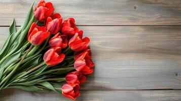 ai generato mazzo di rosso tulipani su un' di legno sfondo. primavera fiori. La madre di giorno sfondo. foto