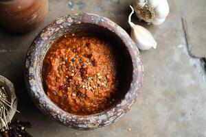 ai generato Harissa salsa, fatto a partire dal caldo rosso Pepe, aglio e spezie. ai creato. foto