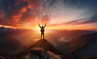 ai generato silhouette di un' uomo in piedi su superiore di un' montagna con il suo mani su a tramonto foto