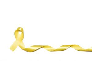 infanzia oro nastro come simbolo di infanzia cancro consapevolezza isolato su bianca sfondo foto