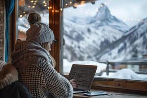 ai generato un' donna lavori a un' il computer portatile a partire dal un' inverno bar nel il montagne. generativo ai foto