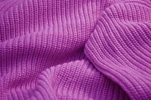 struttura di viola lilla maglieria per sfondo. costola maglia maglione. foto
