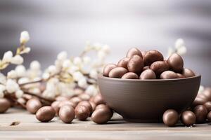 ai generato cioccolato caramelle e Pasqua uovo nel un' ciotola foto