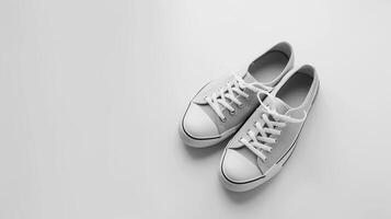 ai generato grigio tela scarpe isolato su piatto bianca sfondo con copia spazio per annuncio. generativo ai foto