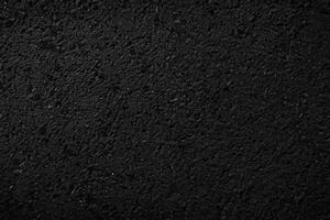 nero asfalto struttura. asfalto strada. pietra asfalto struttura sfondo nero granito ghiaia foto