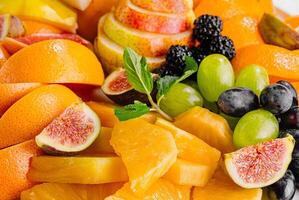 esotico frutta piatto vicino su sfondo foto