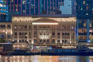 ho chi minh città orizzonte e il saigon fiume. sorprendente colorato notte Visualizza di grattacielo e altro moderno edifici a centro. viaggio concetto foto