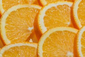 affettato maturo arance come un' cibo sfondo. esotico frutta foto