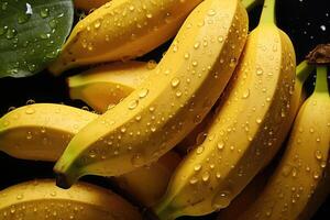 ai generato fresco banane con acqua goccioline contro un' buio sfondo, evidenziazione il vivace giallo colore foto