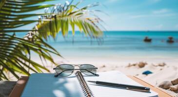 ai generato occhiali da sole e un' diario con un' penna su il spiaggia di il mare foto