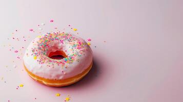 ai generato cosparso rosa ciambella al di sopra di rosa sfondo. delizioso smerigliato cosparso ciambella isolato. foto