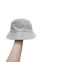 bianca secchio cappello su mano isolato su un' bianca sfondo foto