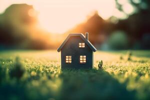 ai generato vita e casa concetto miniatura modello Casa su verde erba con luce del sole astratto sfondo. creato con generativo ai foto