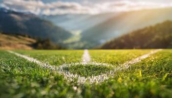 ai generato Basso angolo tiro e avvicinamento di un' illuminata dal sole calcio campo con vivace verde erba e angolo marchio e bellissimo montagne nel il sfondo foto