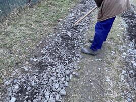 costruzione di strada Riempimento con ghiaia foto