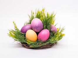 ai generato avvicinamento. Pasqua uova rosa, arancia e viola menzogna nel verde erba nel il forma di un' nido foto