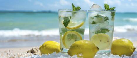 ai generato rinfrescante sulla spiaggia delizia. limonata con ghiaccio e fresco menta servito nel Due bicchieri contro il fondale di il oceano e sabbioso spiaggia. foto