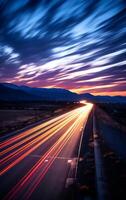 ai generato autostrada nel il montagne a notte con nebbia e leggero sentieri. foto