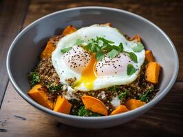 ai generato Budda ciotola con quinoa, fritte uovo e dolce Patata foto