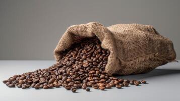 ai generato caffè fagioli nel un' tela ruvida Borsa su un' grigio sfondo foto