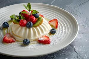 ai generato Pavlova torta con fresco frutti di bosco su un' bianca piatto foto